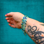 Teal Blue Glass Bead Infinity